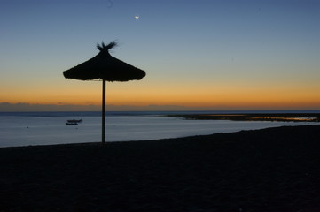 Beach umbrella at dawn