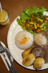 Fototapeta na wymiar Plate of Food with Rice, Vegetables, Meat
