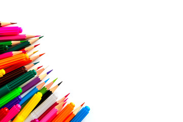 markers and colored pencils are randomly scattered. Isolated on white background