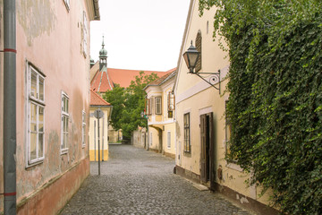 Fototapeta na wymiar Koszeg street view. Small cosy street, old city in a historic medival town. HUNGARY, WESTERN TRANSDANUBIA. Europe old architecture. Cobbled street