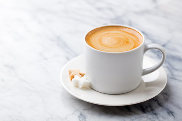 Coffee, espresso in white cup of marble table background. Copy space.