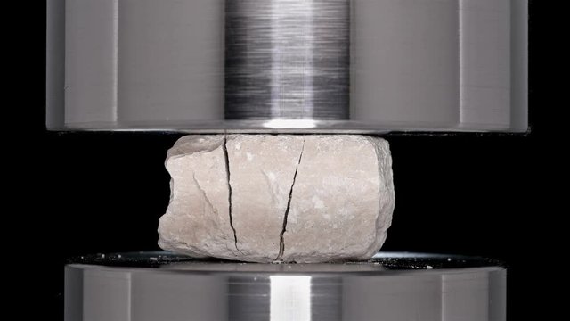 construction crushed stone is tested and tested on a hydraulic press, close-up