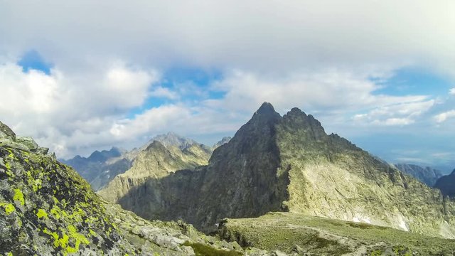 Peaks in High Tatras Mountains: mt.Vysoka (2547m) (on the Left) and mt.Tazky Stit (2500m) (Right), Vysoke Tatry, Slovakia. Picturesque view from the famous mount Rysy (2503m). Time Lapse. 4K UltraHD