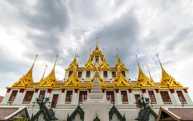 Naklejka premium Loha Prasat , The metallic castle covered with gold leaf at of Wat Ratchanadda Temple in Bangkok, Thailand.