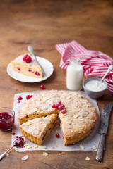 Almond and raspberry cake, Bakewell tart. Traditional British pastry. Wooden background. Copy space.