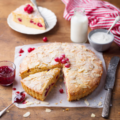 Almond and raspberry cake, Bakewell tart. Traditional British pastry. Wooden background.