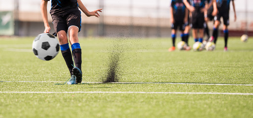 Obraz premium Young children player on the football match