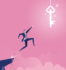 Businessman jumping off cliff for a big hanging key