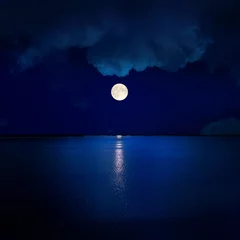 Foto op Canvas volle maan in wolken boven water © Mykola Mazuryk