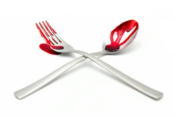 fork and spoon cutlery with blood on a white background