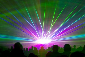 Laser show rays. Very colorful show with a crowd silhouette and great laser rays on pyrotechnic festival