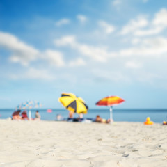 sea, sand and umbrellas under hot sun