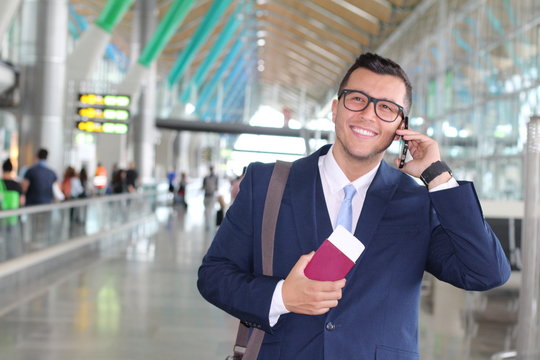 Global Business Concept With Business Man On His Cell Phone Isolated At The Airport