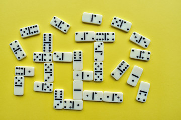 domino pieces on a yellow background