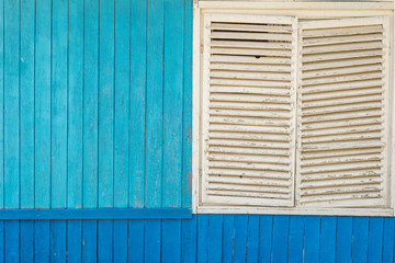 blue wooden old wall and white window exterior