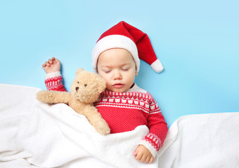 Baby child santa hat slepping,empty space background.