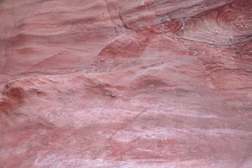 Texture of red sandstone. Background from the structure of mountains in a Great Red Canyon in Israel.