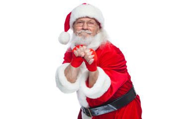 Christmas. Santa Claus with red bandages wound on his hands for boxing imitates kicks. Kickboxing, karate, boxing. Isolated on white background.