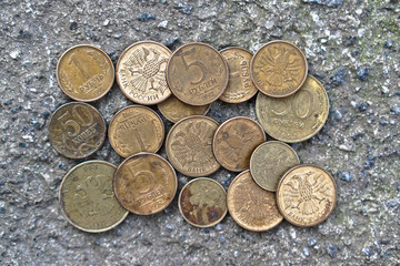 Russian coins on the background of concrete. set of coins for the numismatics of rubles. Coat of arms with two-headed eagle