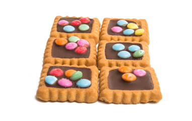 cookies with chocolate colored jelly beans isolated