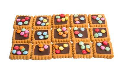 cookies with chocolate colored jelly beans isolated