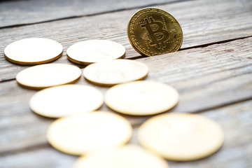 Gold Bitcoin money on wooden table. Electronic crypto currency