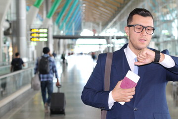 Focused businessman checking his watch 