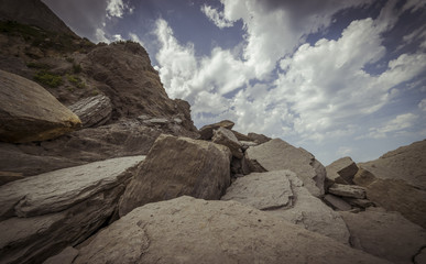 Beach with rocks in summer. Playa de la Arnía in Santander, Spain