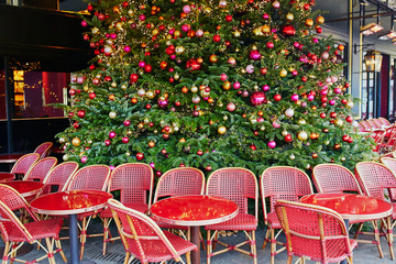 Outdoor Parisian cafe with beautiful Christmas tree