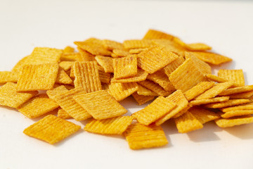 Spicy wheat chips, isolated on a white background. Chinese chips, appetizers.