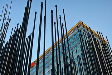 Obraz premium Steel rebar rising up to form a building under construction