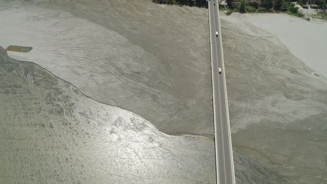 Modern bridge over river with cars in a mountain province Philippines,Luzon. Aerial view Bucao Bridge.