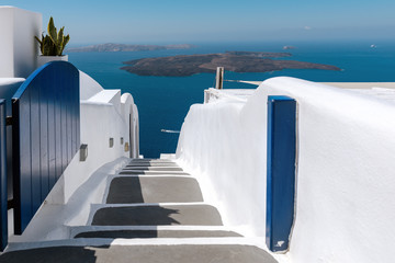 Open gate with road down to the sea at Santorini island, Greece
