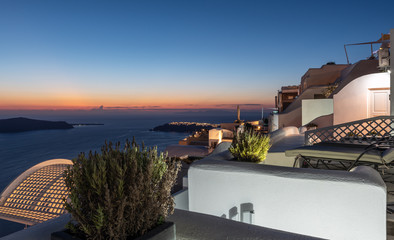 Beautiful sunset above volcanic caldera of Santorini island, Greece