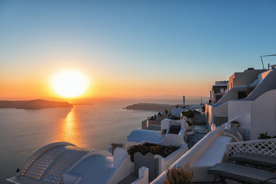 Beautiful sunset over volcanic caldera at Santorini island, Greece