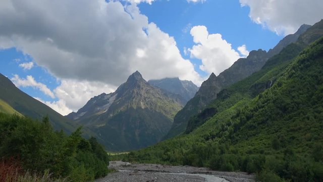 View river scenes in mountains, national park Dombai, Caucasus, Russia. Summer landscape, sunshine weather, blue sky and sunny day