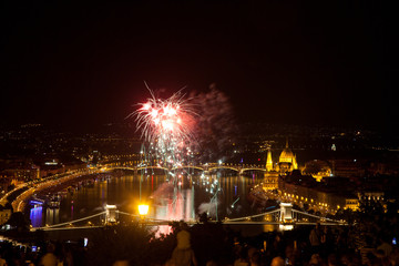 Fototapeta na wymiar the 20th of August fireworks over Budapest Parliament, the Danube and chain bridge on St. Stephens or foundation day of Hungary