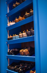 showcase with shoes in the store, showcase with shoes in the studio, wardrobe with shoe and boots (vertically)