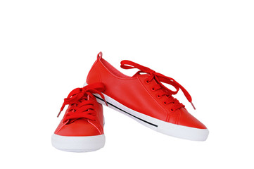A pair of red sneakers. White isolate.