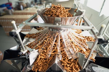 Foto op Plexiglas Closeup of salty snacks in food factor production line. © dusanpetkovic1
