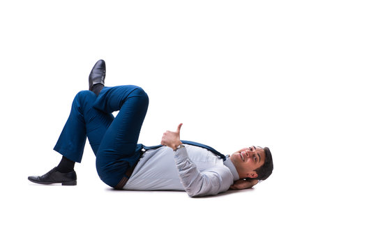 Businessman lying on the floor isolated on white