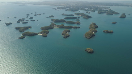 Aerial view of Small islands with beaches and lagoons in Hundred Islands National Park, Pangasinan, Philippines. Famous tourist attraction, Alaminos.