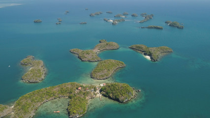 Fototapeta na wymiar Aerial view of Small islands with beaches and lagoons in Hundred Islands National Park, Pangasinan, Philippines. Famous tourist attraction, Alaminos.