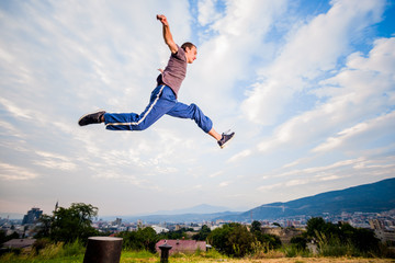 Man outdoors practicing parkour