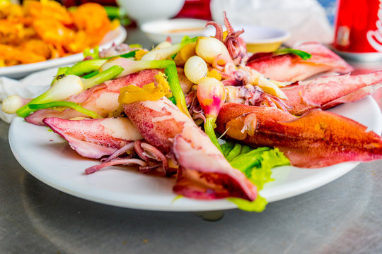 Vietnamese sea food, plate of steamed ginger sea squid, popular sea food of coastal people in Vietnam