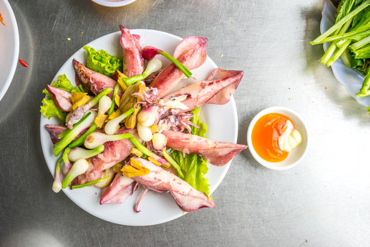 Vietnamese sea food, plate of steamed ginger sea squid, popular sea food of coastal people in Vietnam