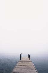 Fototapeta premium pier on lake in the fog