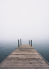 Fototapeta na wymiar pier on the lake in the fog