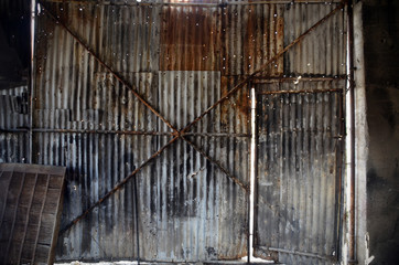 corrugated metal door and wall of old repair garage