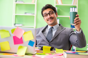 Businessman unhappy with many conflicting priorities sitting in 